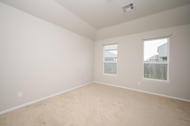 108 Shallow Creek Dr, Waller, TX 77445 - spare room featuring carpet flooring, baseboards, and lofted ceiling
