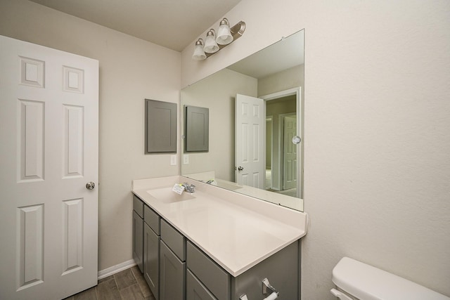 108 Shallow Creek Dr, Waller, TX 77445 - half bath featuring wood finished floors, toilet, vanity, and baseboards
