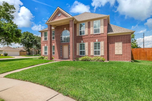 14406 Concord Grv, Houston, TX 77084 - georgian-style home with roof with shingles and brick siding