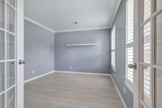 14406 Concord Grv, Houston, TX 77084 - unfurnished room with french doors, crown molding, baseboards, and wood finished floors