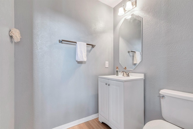 14406 Concord Grv, Houston, TX 77084 - bathroom with toilet, wood finished floors, and vanity