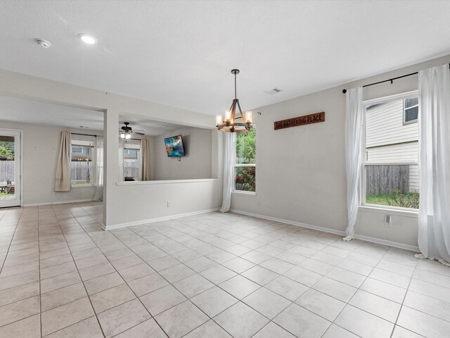 14203 Broad Cypress Ct, Houston, TX 77068 - unfurnished room featuring a chandelier, baseboards, light tile patterned flooring, a smoke detector, and a ceiling fan