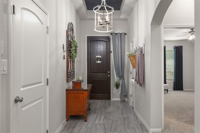 5734 Arden Way, Pasadena, TX 77505 - foyer entrance featuring arched walkways, a ceiling fan, a chandelier, and baseboards