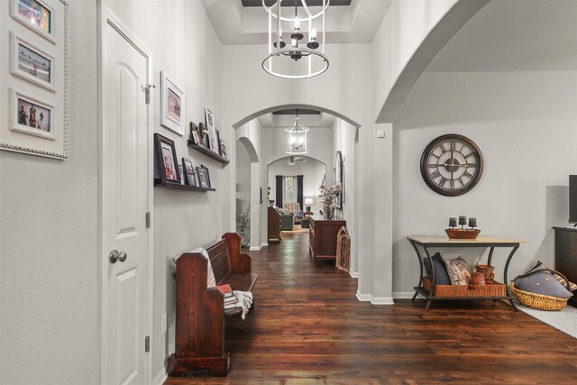 5734 Arden Way, Pasadena, TX 77505 - entryway featuring arched walkways, wood finished floors, a chandelier, and baseboards