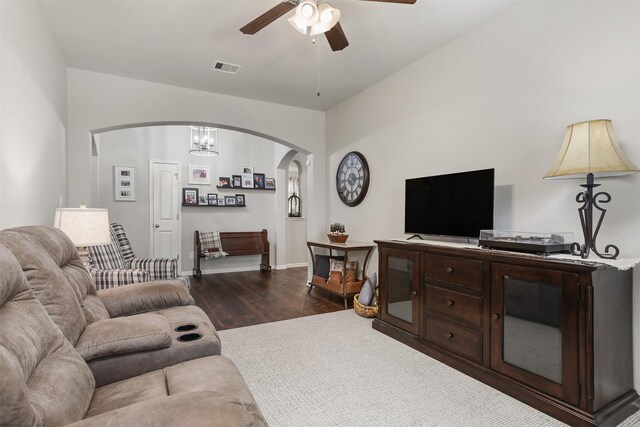 5734 Arden Way, Pasadena, TX 77505 - living room with arched walkways, a ceiling fan, and dark wood-style floors