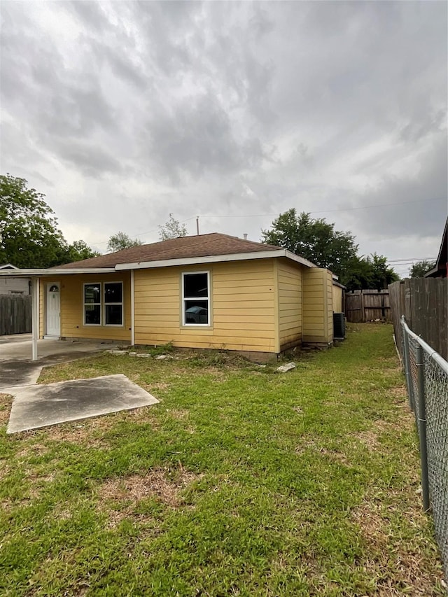 rear view of property featuring a patio