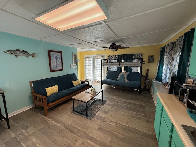 1428 Fm 2031st St S, Matagorda, TX 77414 - living area with ceiling fan, wood finished floors, and baseboards
