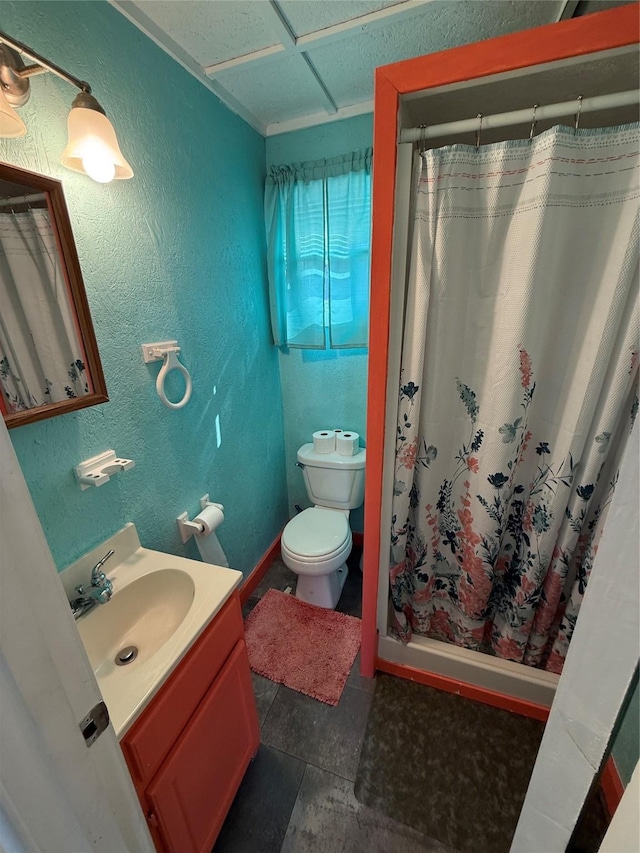 1428 Fm 2031st St S, Matagorda, TX 77414 - bathroom featuring toilet, vanity, a shower with curtain, and a textured wall