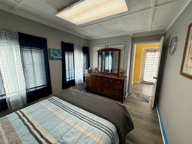 1428 Fm 2031st St S, Matagorda, TX 77414 - bedroom featuring hardwood / wood-style floors and baseboards