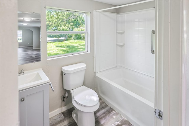 1011 N Arcola St, Angleton, TX 77515 - bathroom featuring wood finished floors, vanity, healthy amount of natural light, and toilet