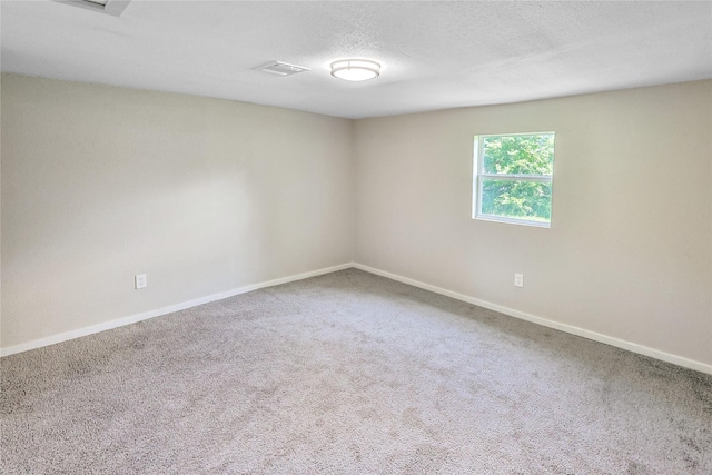1011 N Arcola St, Angleton, TX 77515 - carpeted spare room featuring baseboards and a textured ceiling