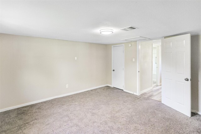 1011 N Arcola St, Angleton, TX 77515 - below grade area featuring light colored carpet and baseboards