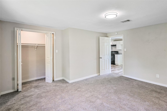 1011 N Arcola St, Angleton, TX 77515 - unfurnished bedroom featuring carpet flooring, baseboards, and a closet