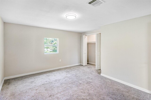 1011 N Arcola St, Angleton, TX 77515 - unfurnished bedroom with carpet flooring, baseboards, and a closet
