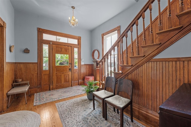 1818 Decatur St, Houston, TX 77007 - entryway featuring a wainscoted wall, plenty of natural light, wooden walls, a chandelier, and stairway