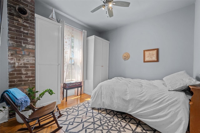 1818 Decatur St, Houston, TX 77007 - bedroom with light wood-style floors, multiple windows, and a ceiling fan