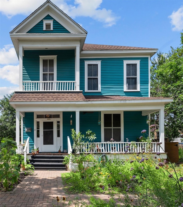 1818 Decatur St, Houston, TX 77007 - view of front of house with covered porch, a balcony, and roof with shingles