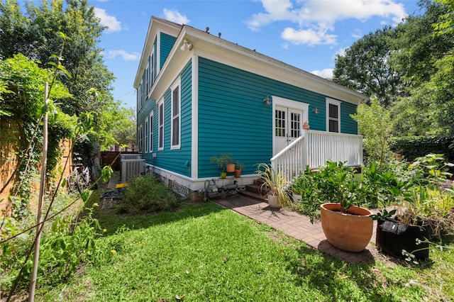 1818 Decatur St, Houston, TX 77007 - rear view of house with a yard and central AC unit