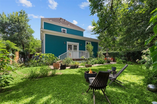1818 Decatur St, Houston, TX 77007 - back of house featuring an outdoor fire pit, a yard, and french doors