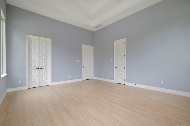 250 Hampton Glen Rd, Montgomery, TX 77356 - empty room with a high ceiling, light wood-style floors, and baseboards