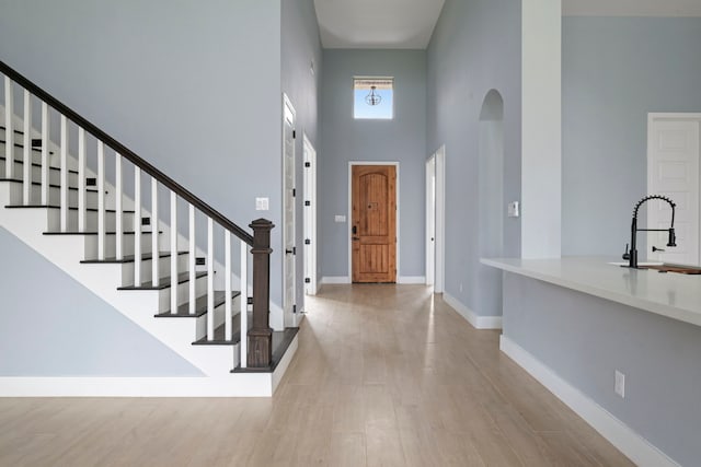 250 Hampton Glen Rd, Montgomery, TX 77356 - foyer with a towering ceiling, wood finished floors, stairs, and baseboards