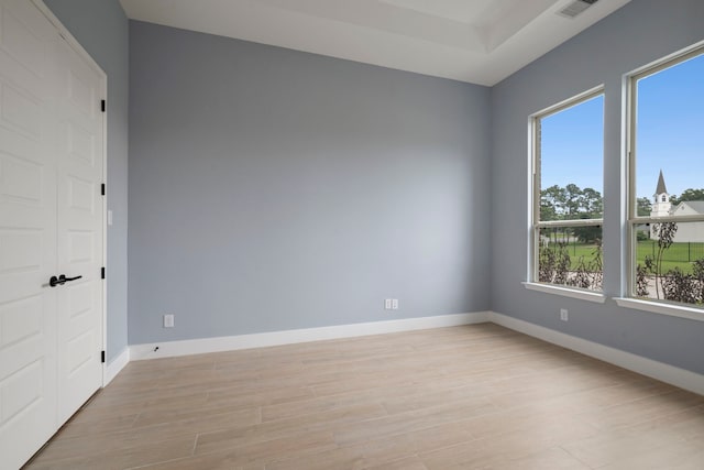 250 Hampton Glen Rd, Montgomery, TX 77356 - spare room featuring healthy amount of natural light, light wood-style flooring, and baseboards