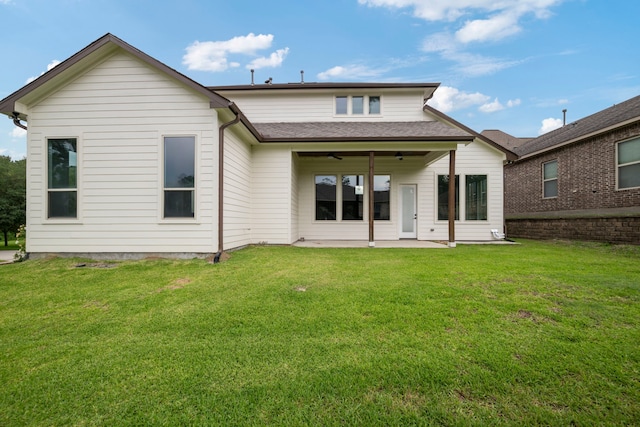 250 Hampton Glen Rd, Montgomery, TX 77356 - back of property with a patio area, ceiling fan, a lawn, and roof with shingles