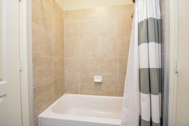 bathroom featuring shower / bathtub combination with curtain