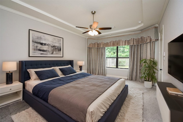 bedroom featuring carpet flooring, crown molding, and a ceiling fan