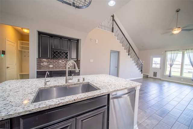 5422 Nobel Earl Ct, Katy, TX 77493 - kitchen featuring stainless steel dishwasher, a sink, open floor plan, baseboards, and a ceiling fan