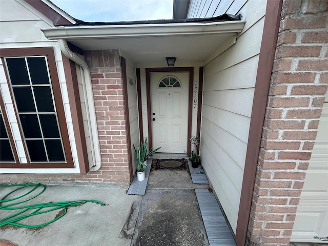 13507 White Cliff Dr, Houston, TX 77065 - view of exterior entry featuring brick siding