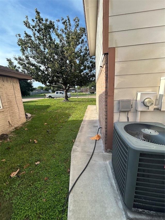 13507 White Cliff Dr, Houston, TX 77065 - view of green lawn with central AC unit