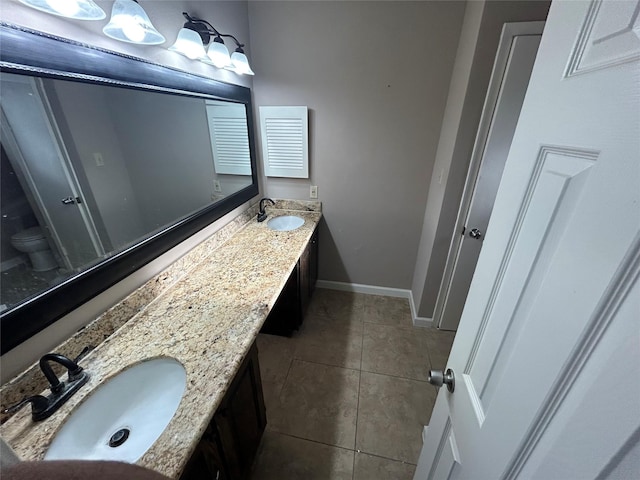 13507 White Cliff Dr, Houston, TX 77065 - full bath featuring tile patterned flooring, double vanity, baseboards, and toilet