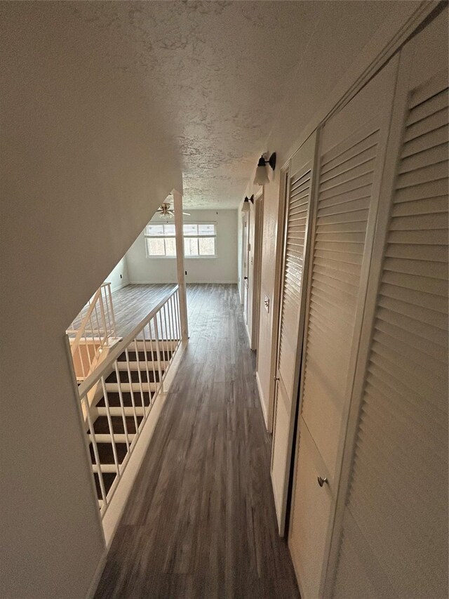 13507 White Cliff Dr, Houston, TX 77065 - corridor featuring a textured ceiling and dark wood-style flooring