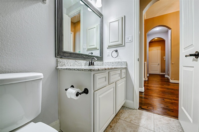 6315 Asbury Brook Ct, Katy, TX 77493 - half bath featuring toilet, vanity, tile patterned floors, and baseboards