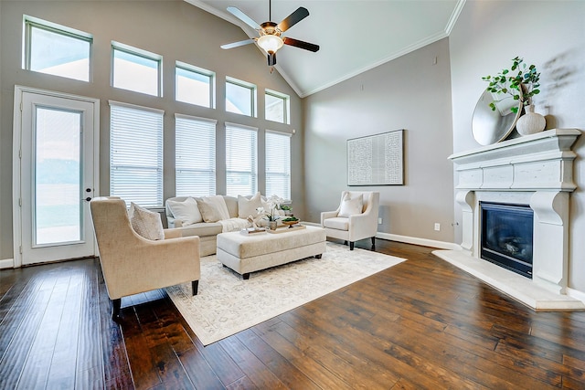6315 Asbury Brook Ct, Katy, TX 77493 - living area with crown molding, dark wood-type flooring, ceiling fan, a glass covered fireplace, and baseboards