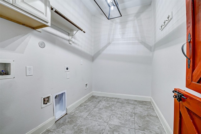 6315 Asbury Brook Ct, Katy, TX 77493 - laundry room featuring cabinet space, washer hookup, electric dryer hookup, baseboards, and hookup for a gas dryer