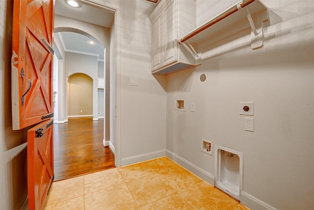 6315 Asbury Brook Ct, Katy, TX 77493 - laundry area with arched walkways, hookup for an electric dryer, washer hookup, cabinet space, and hookup for a gas dryer