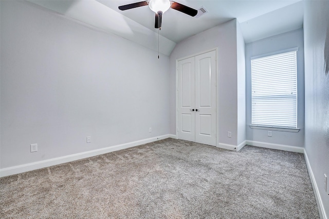 6315 Asbury Brook Ct, Katy, TX 77493 - unfurnished bedroom featuring carpet flooring, a closet, baseboards, lofted ceiling, and ceiling fan