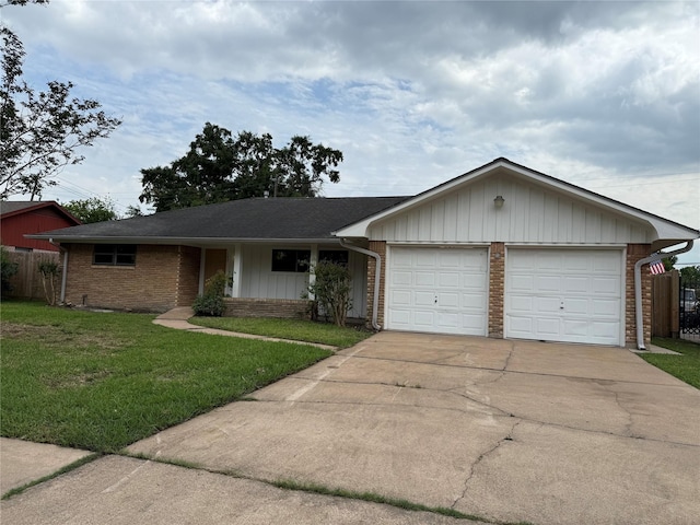 single story home with a garage, brick siding, and driveway