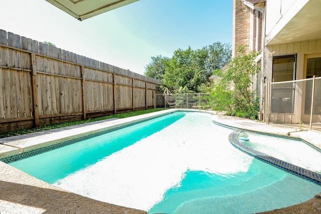 11810 Braesridge Dr, Houston, TX 77071 - view of swimming pool with fence and a pool with connected hot tub
