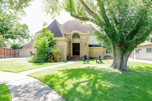 11810 Braesridge Dr, Houston, TX 77071 - french country inspired facade with brick siding and a shingled roof