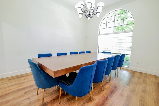 11810 Braesridge Dr, Houston, TX 77071 - dining area with crown molding, a chandelier, baseboards, and light wood finished floors