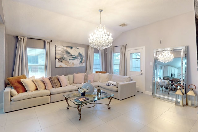 13931 Pueblo Run, Cypress, TX 77429 - living area with a chandelier, plenty of natural light, vaulted ceiling, tile patterned flooring, and baseboards
