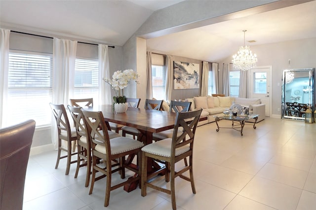 13931 Pueblo Run, Cypress, TX 77429 - dining space with lofted ceiling, plenty of natural light, a chandelier, and light tile patterned floors