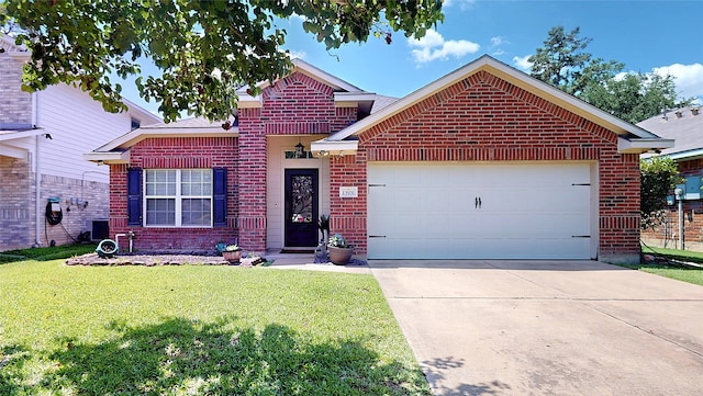 13931 Pueblo Run, Cypress, TX 77429 - view of front of house with brick siding, a front yard, driveway, and an attached garage