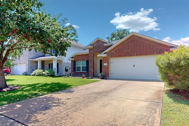 13931 Pueblo Run, Cypress, TX 77429 - view of front facade featuring brick siding, a garage, a front lawn, and driveway