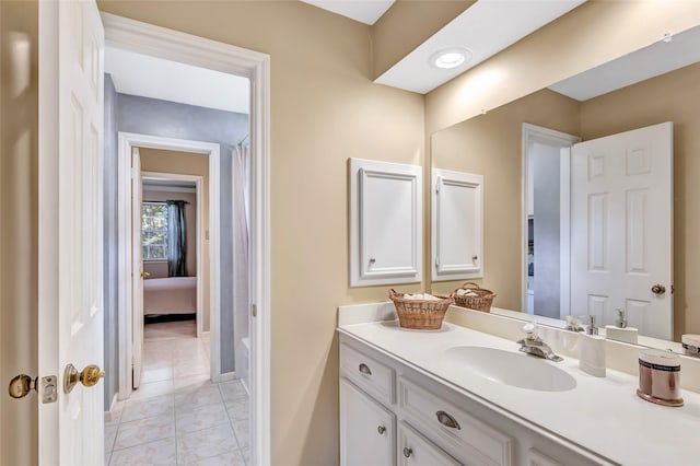 full bath with vanity and marble finish floors