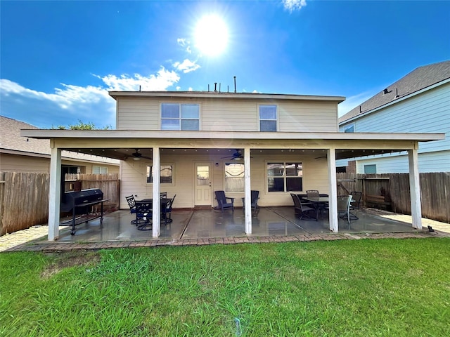 back of house featuring a ceiling fan and a patio area