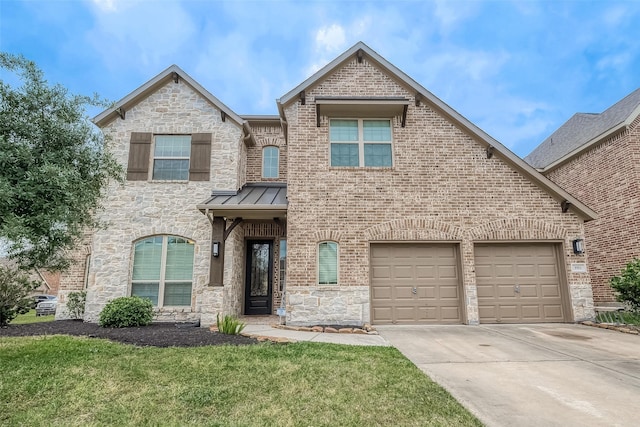 3911 Avalon Ridge Dr, Spring, TX 77386 - french country style house featuring driveway, a standing seam roof, a front yard, stone siding, and brick siding